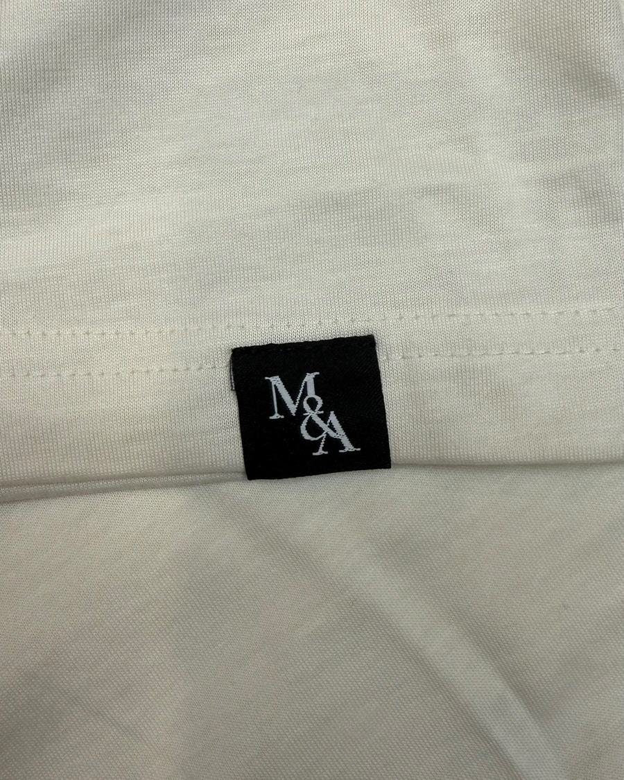 The custom woven neck label inside the collar.