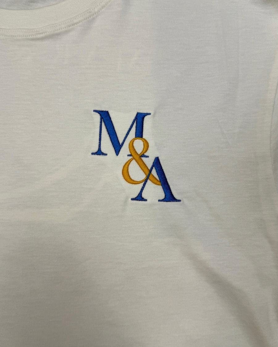 Macro of the M&A monogram, stitched rather than screened.