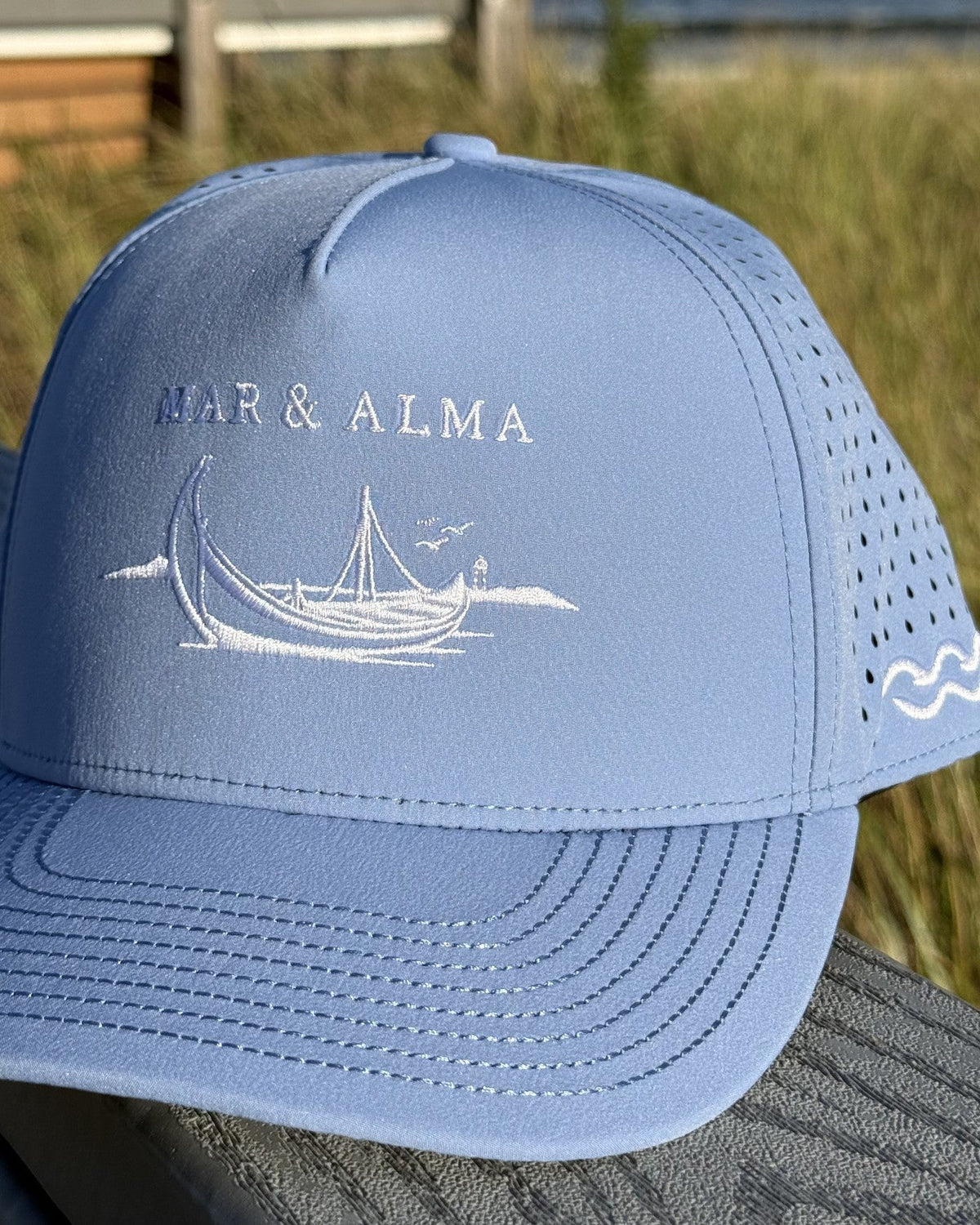 The Heritage Snapback in the teen fit, Atlântico blue, Mar and Alma embroidered in white above the moliceiro.