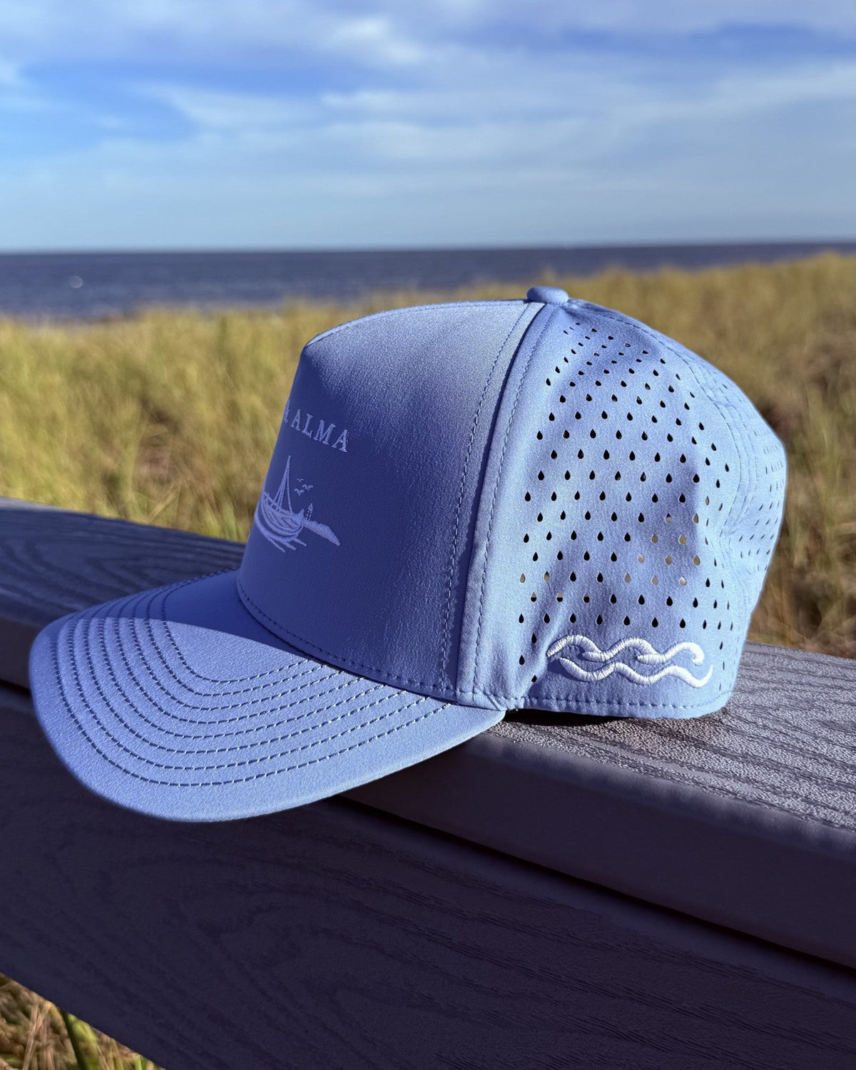 The side of the teen fit snapback, the white wave mark above the perforated panel.