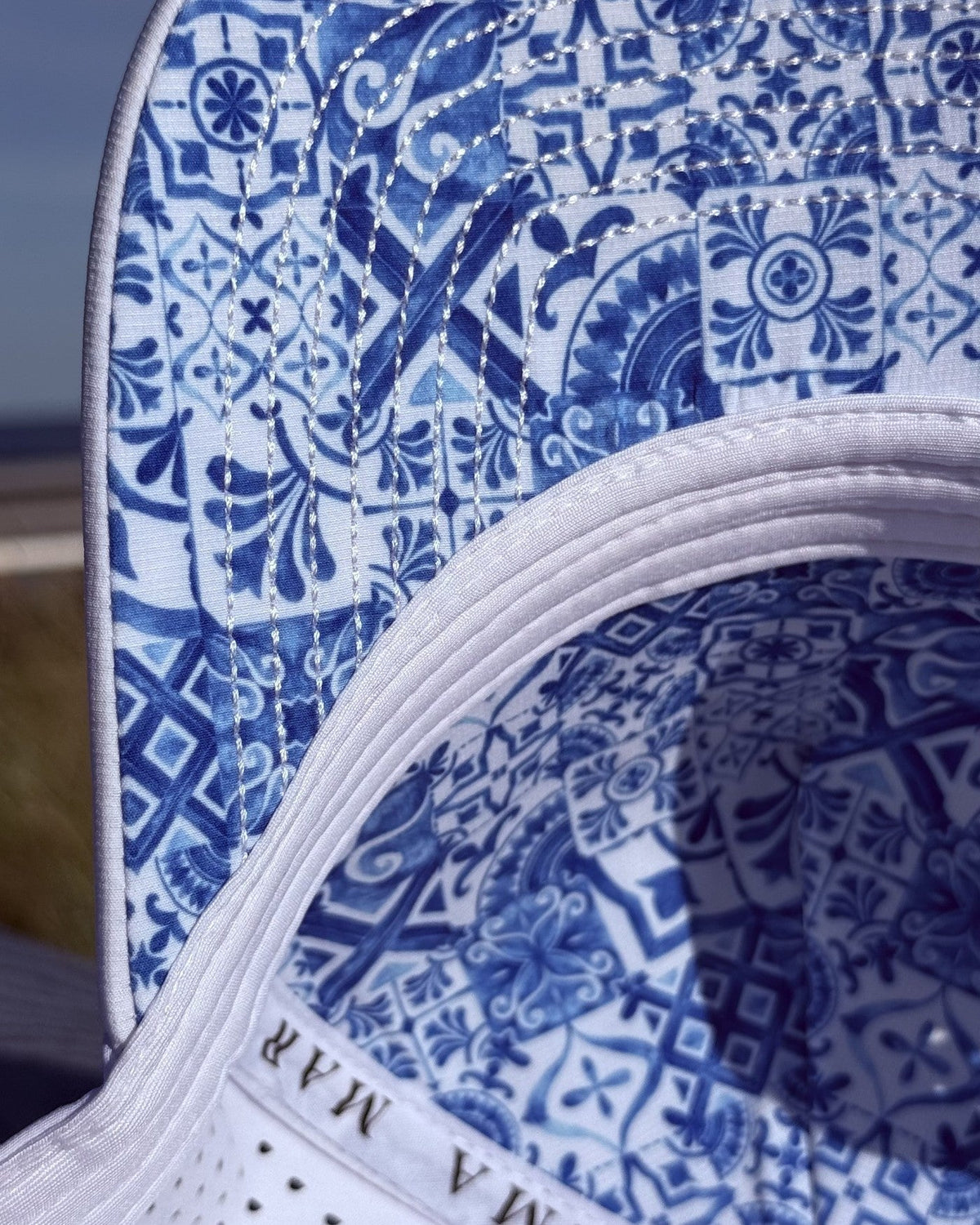 Close up of the azulejo tile lining inside the white snapback.
